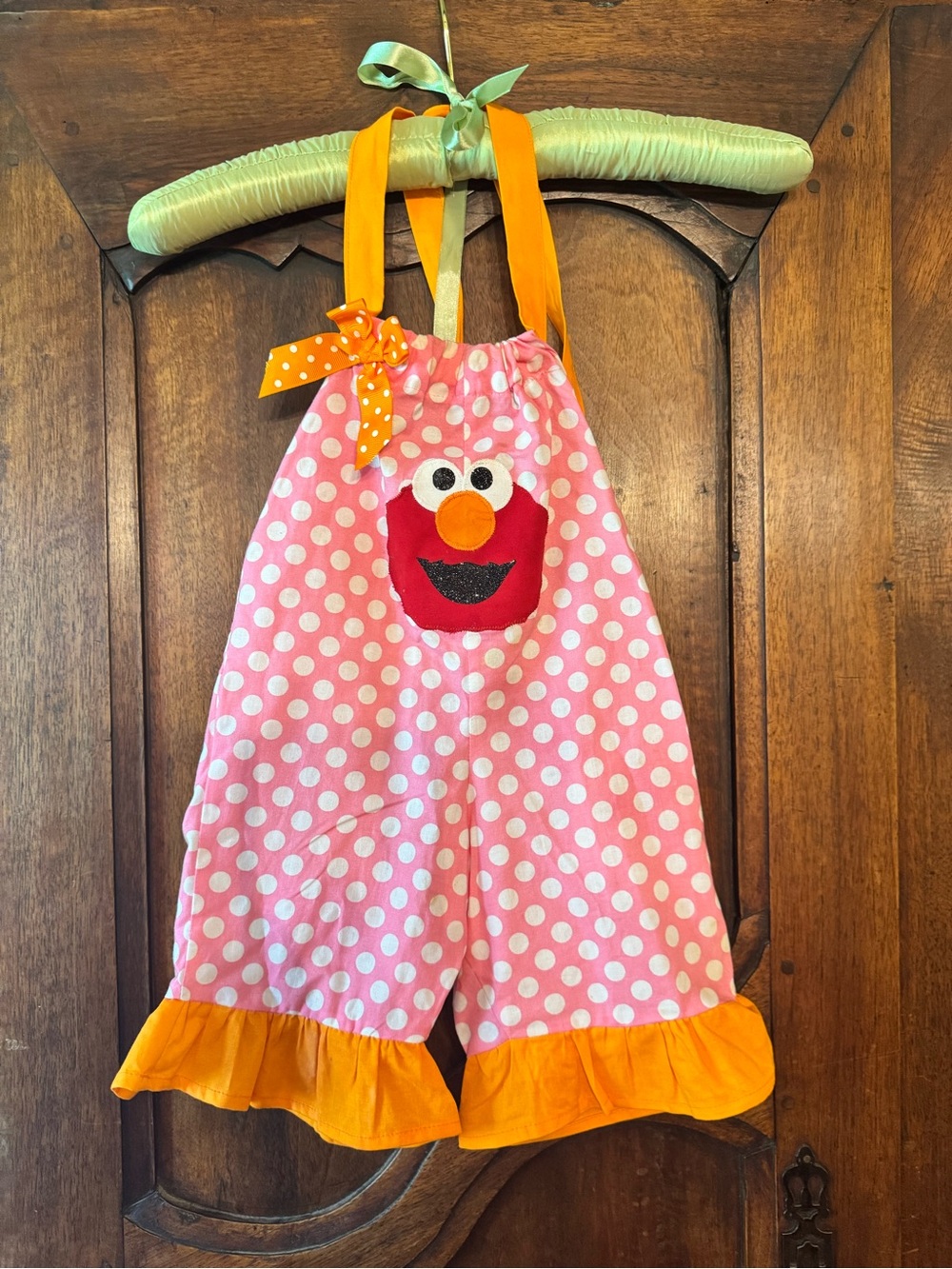 Lil’ Bug Clothing Pink Polka Dot Elmo Girls Romper with Orange Ruffle